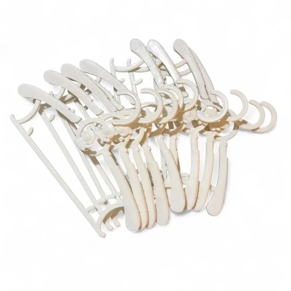 9 White plastic baby clothes hangers with bear design